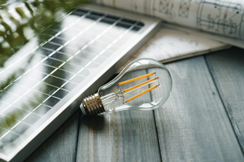 Solar energy panel and light bulb, green energy